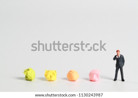 businessman with colorful paper (idea for saving paper)