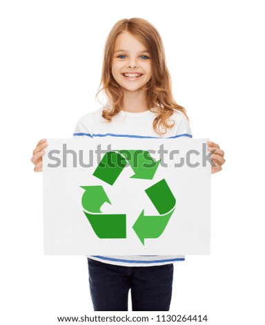 waste recycling, reuse, environment and ecology concept - happy girl with picture of green recycle symbol on paper over white background