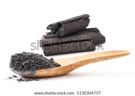 Activated charcoal powder on white background Royalty-Free Stock Photo #1130304737