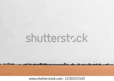 Abstract background from white concrete wall in empty room with brown wood floor. Building and construction backdrop.