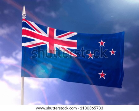 Flag of New Zealand with flare and dark blue sky