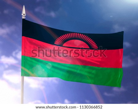 Flag of Malawi with flare and dark blue sky