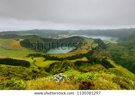 Panoramic landscape from Azores lagoons. The Azores archipelago has volcanic origin and the island of Sao Miguel has many lakes fand is the best travel destination of Portugal.