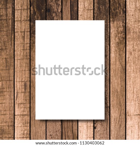 mock up white poster frame on vintage brown wood carpentry background texture for design and decorate interior concept