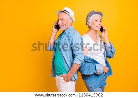 Fun joy lifestyle leisure meeting discuss chatting concept. Close up photo portrait of excited joyful beautiful busy business old couple making arrangement using phone isolated bright background