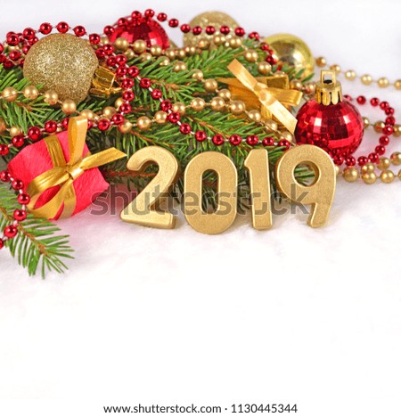 2019 year golden figures and spruce branch and Christmas decorations