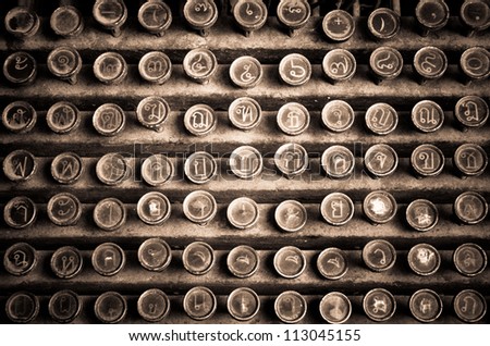 Close up photo of antique Thai typewriter keys,