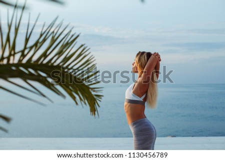   Young beautiful woman doing stretching