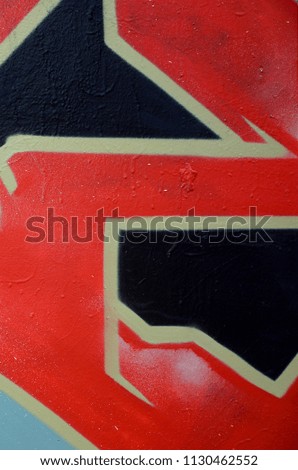 Street art. Abstract background image of a fragment of a colored graffiti painting in red tones