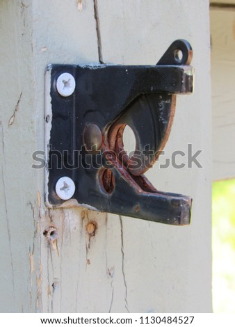 An old rusted gate latch
