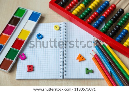 Colorful stationery, set of pencils, paints, textbook for education. Back to school concept