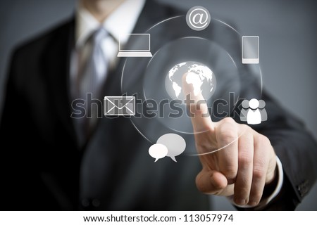 Business man pressing an icon in air Royalty-Free Stock Photo #113057974