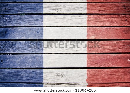 french flag painted on old wood plank background