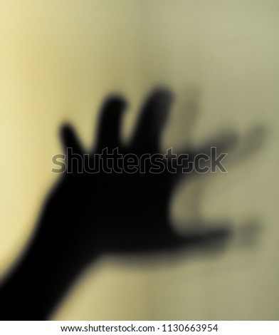  Blur image of hand shadow on vintage wall background