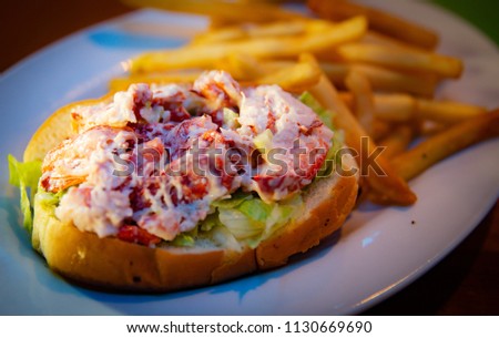 New England Lobster Roll with Fries Royalty-Free Stock Photo #1130669690