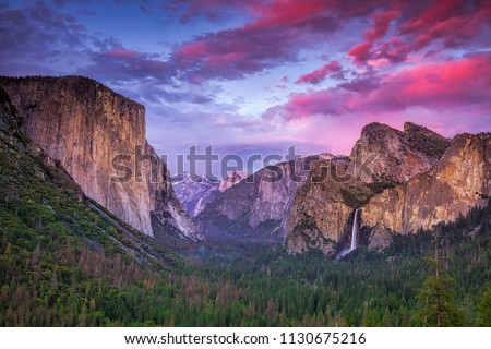 Vibrant sunset over Tunnel View in California's Yosemite National Park Royalty-Free Stock Photo #1130675216