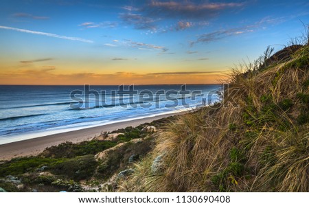 dramatic Venus bay beach sunrise sand dunes coast sand dunes native vegetation blue sky southern ocean Australia south Gippsland