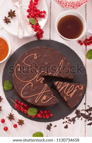 Sachertorte with red currant.