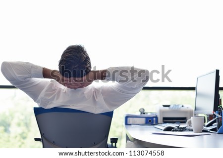 happy young business  man work in modern office on computer Royalty-Free Stock Photo #113074558