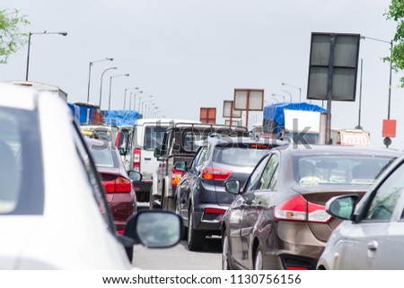 Cars on the road in traffic jam. Traffic situation in the Mumbai city. Pollution situation in India. 