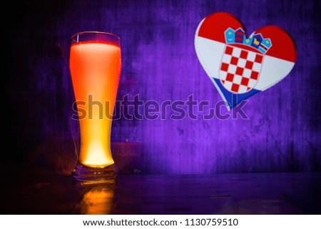 Single beer glass on table. Love Croatia and drink beer concept. Selective focus