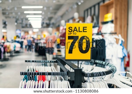 Abstract blurred background of Department store with sale. Store discount sign. Sale sign. Sale concept. Shopping sales sign with percentage discount on price tag