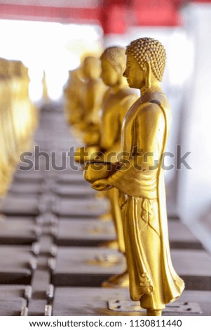Many Golden  of Buddha,behind is Golden Buddha soft focus,religion art concept.