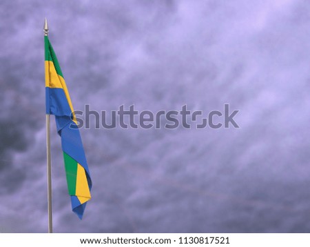 Flag of Gabon hanging down dangling