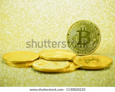 golden bitcoins with close up view on the glitter background