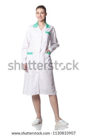 Young pretty smiling nurse portrait. Isolated on white background.