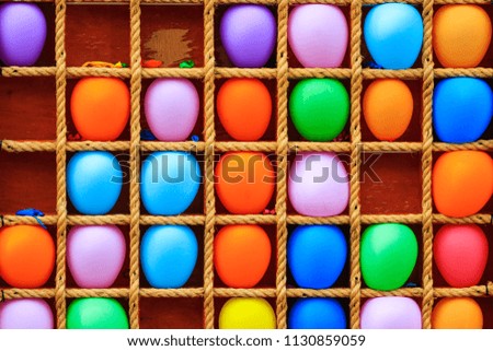 colored balls and target shelf with rope