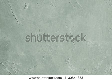 grey textured background. abstract stucco design. distressed scratched rough plaster backdrop. copy space concept