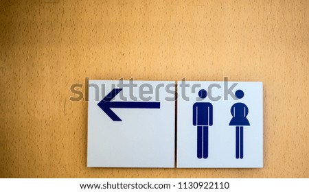 An entrance to the male and female toilet