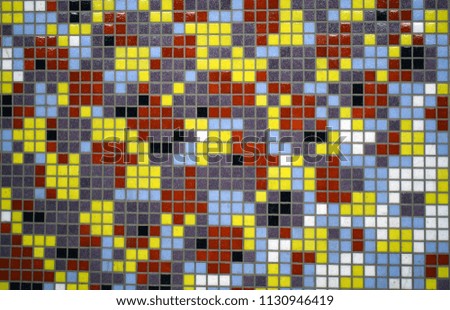 Background as pixels of a multicolored mosaic. Wall with colored ceramic tiles.