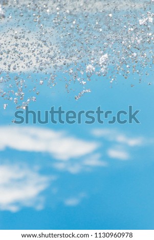 water jet with spray on the sky background