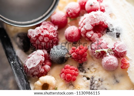 Delicious ice cream cake with frozen berries , selective focus.