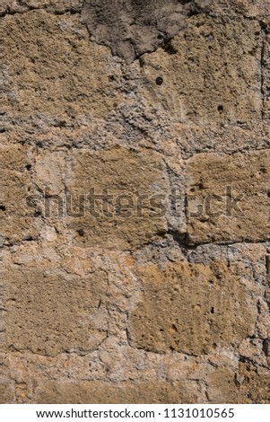 Vertical view of an old brick wall texture. No people.