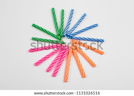 
Colorful Birthday Candles on White Backdrop