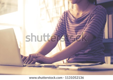 Business woman using laptop in business Home office