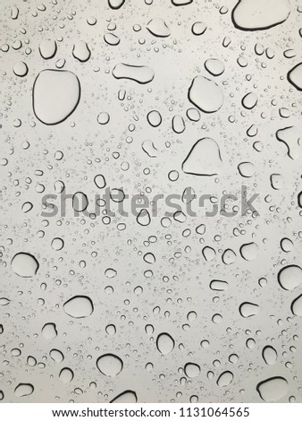 Rain droplets on glass background.