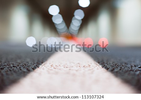 Interior of an urban tunnel without traffic from the ground level - shallow depth of field and  light bokeh