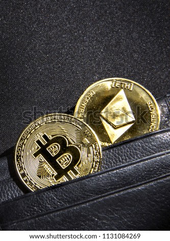 on a black background with a bokeh with sequins is a black leather wallet purse for money with a coin of currency crypto etherium and bitcoin 
