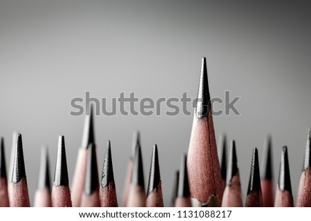 One pencil standing out from the group of other pencil.Leadership and growth in business concept.
 Royalty-Free Stock Photo #1131088217