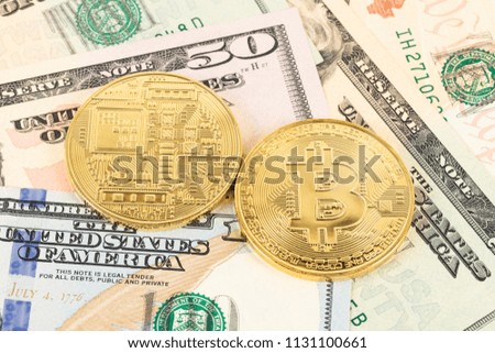 Bitcoin token on dollar banknote money
