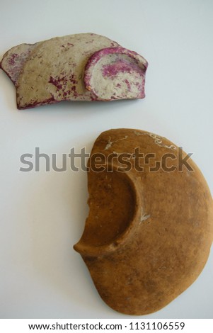 Pieces of an ancient ceramic bowls on white background