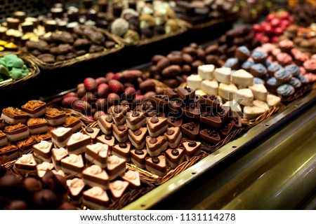 Famous sweet candy market .Confectionery at Boqueria market place in Barcelona, Spain. Assorted chocolate candy shop. Royalty-Free Stock Photo #1131114278