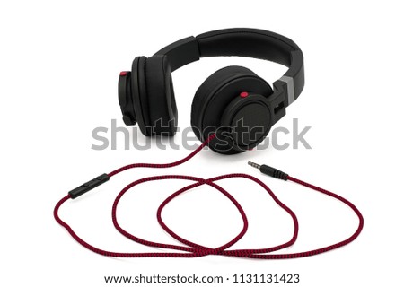 Black headphones with red cable isolated on white background