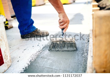 construction worker using brush and primer for hydroisolating and waterproofing house Royalty-Free Stock Photo #1131172037