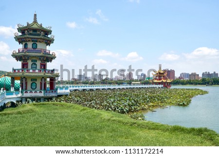 Spring and Autumn Pavilions on the Lotus Pond in Kaohsiung city in Taiwan. Bridge connects it to the shore. Panoramic view to the beautiful and popular tourist sightseeing attraction.