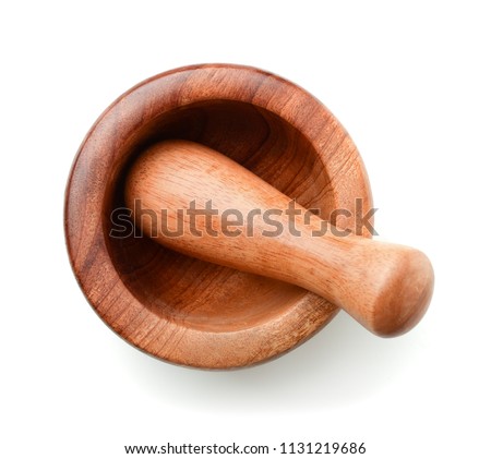 Top view of wooden mortar and pestle isolated on white Royalty-Free Stock Photo #1131219686
